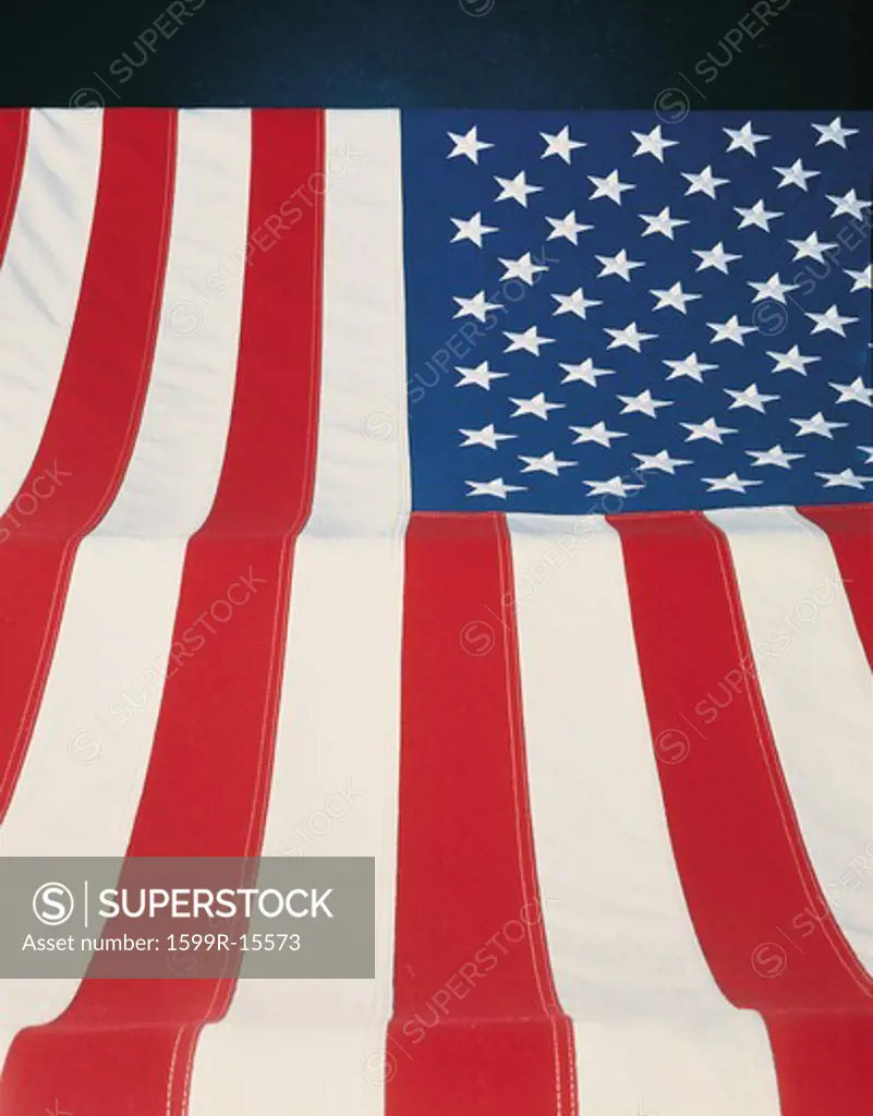 This is a vertical view of the American flag. The field of stars is at the upper left hand corner with the stars coming toward the viewer at the bottom.