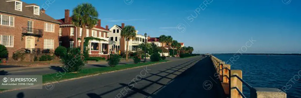 These are historic houses on Battery Street . They are next to the waterfront. They show the Southern living style in morning light.