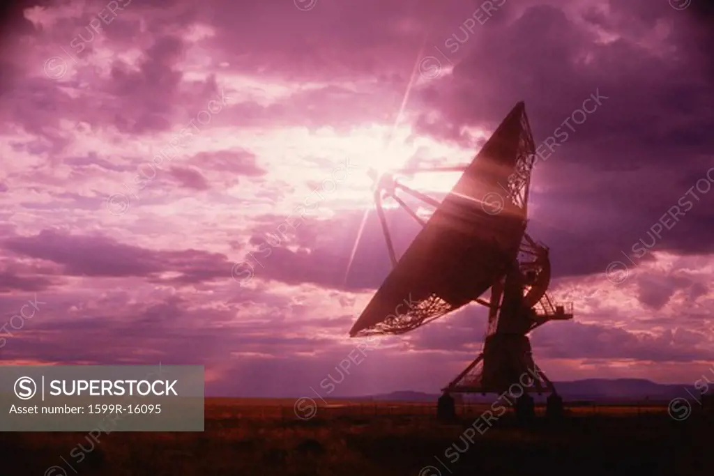 VLA Very Large Array radio telescope dishes against purple sky