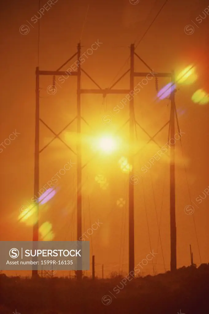 Power lines with sunburst