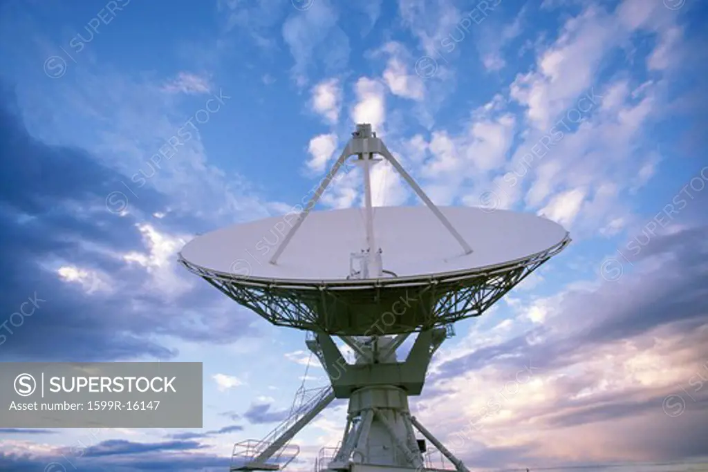 VLA Very Large Array radio telescope dish against clouds