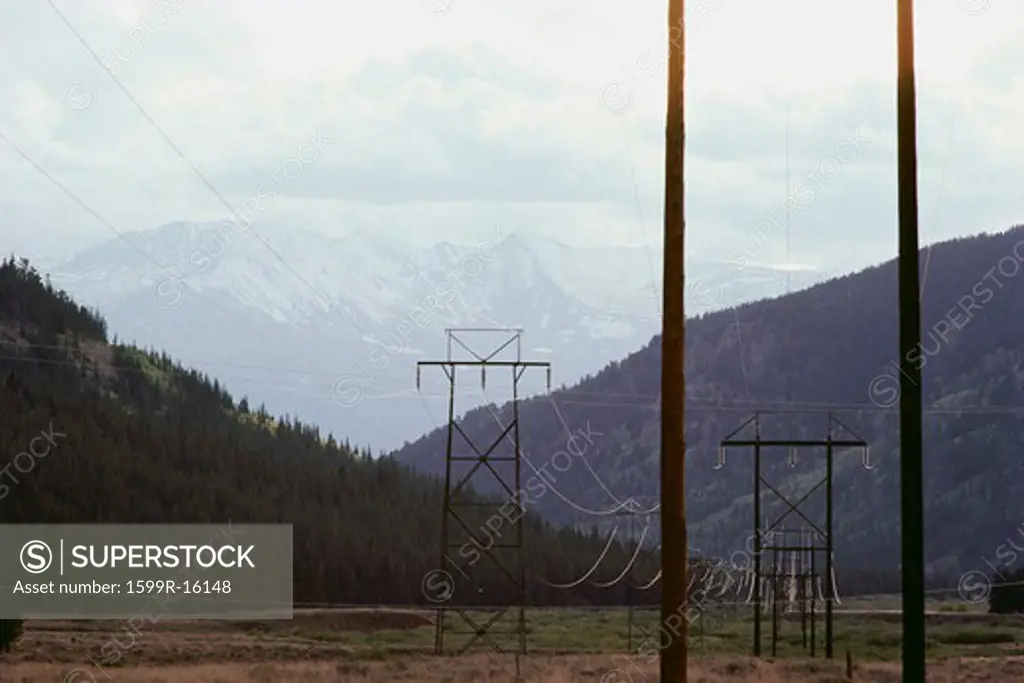 Pylons against mountain backdrop