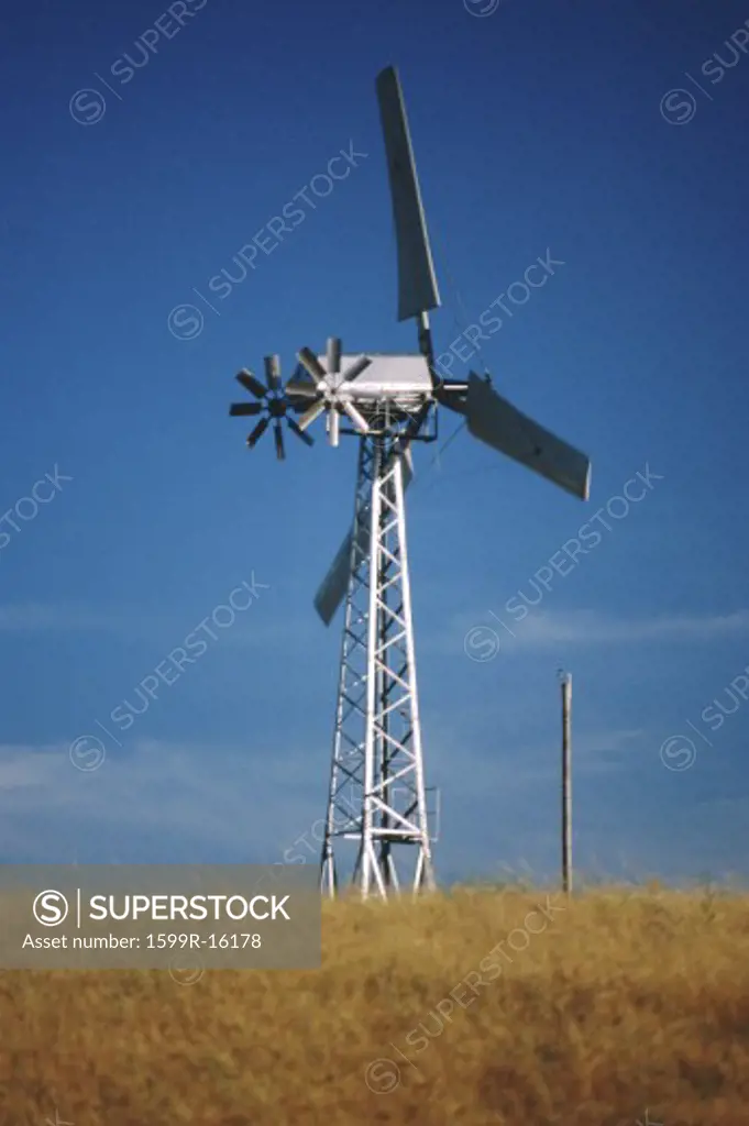 Wind turbine in grassy field