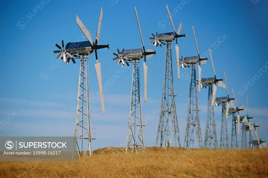 Row of wind turbines on ground