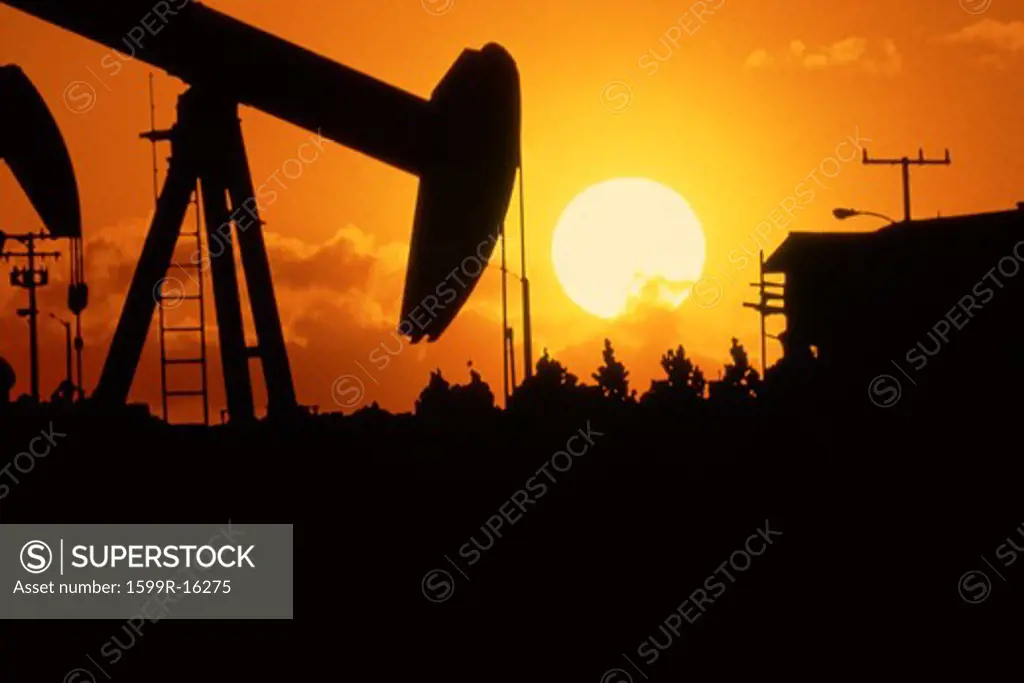 Oil drill at sunset