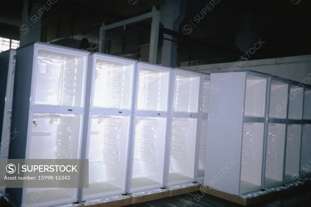 Rows of refrigerators without doors