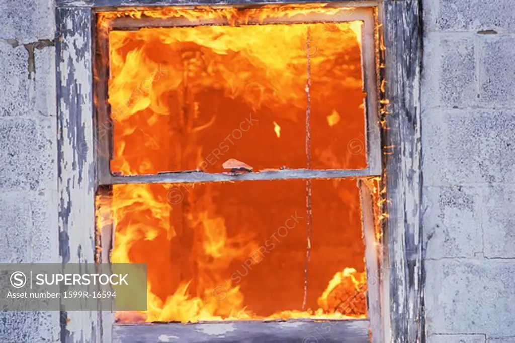 Fire seen through building window