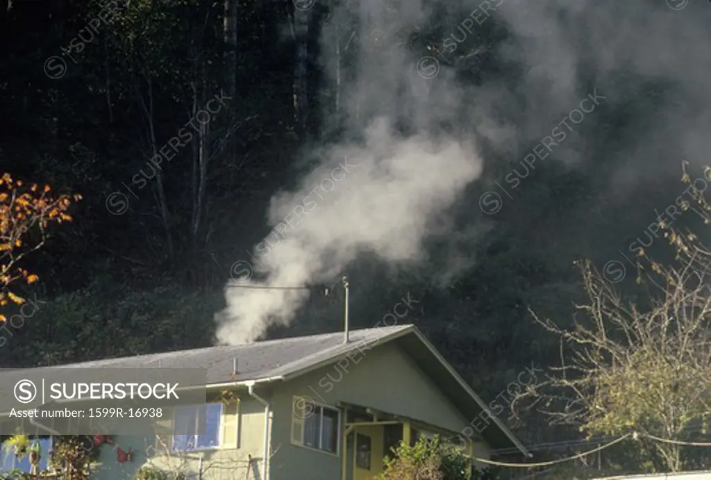 Smoke emanating from a wood burning stove in a small house