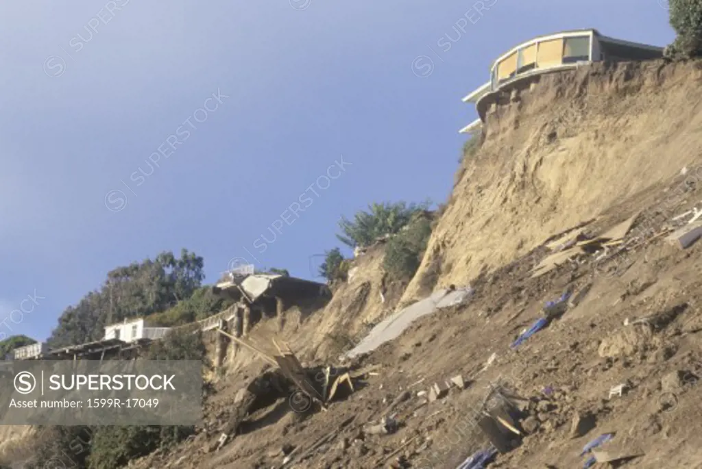 A home in Pacific Palisades, damaged in the Los Angeles earthquake of January 17, 1994, towering above part of its own roof and debris on a hillside