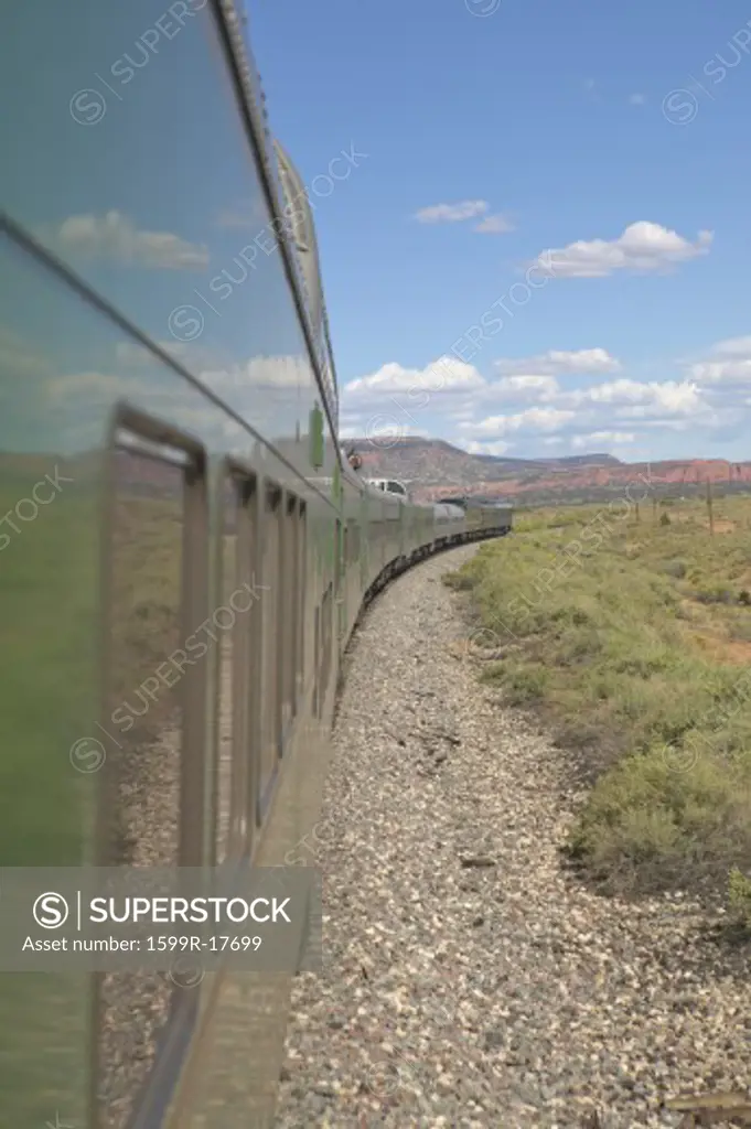 Whistle Stop Kerry Express across America train moving through landscape, American Southwest