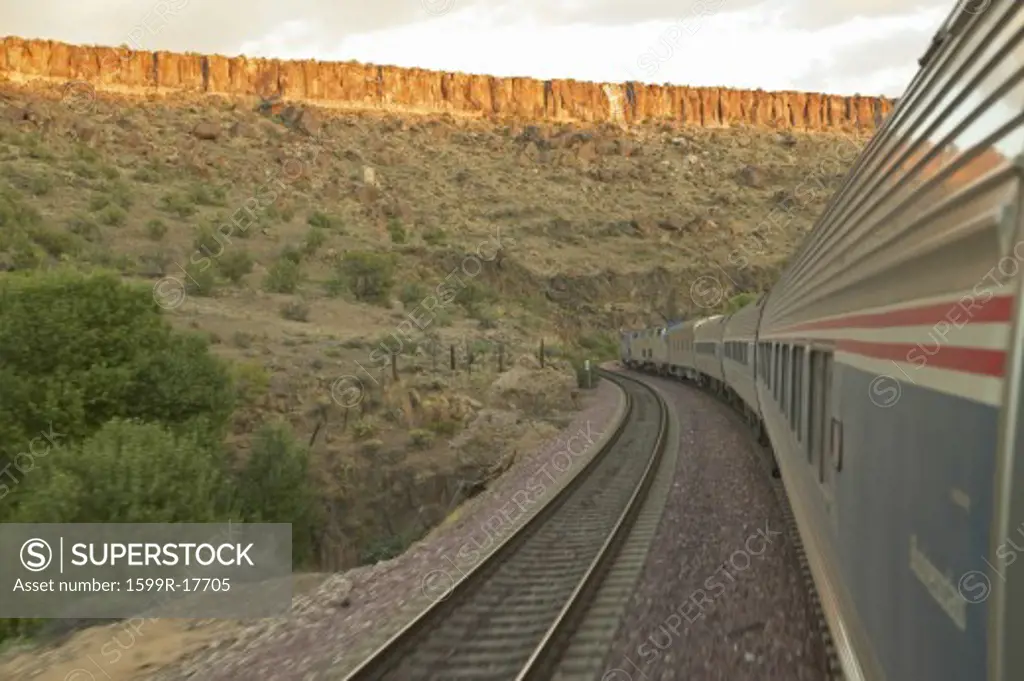 Whistle Stop Kerry Express across America train moving through landscape, American Southwest