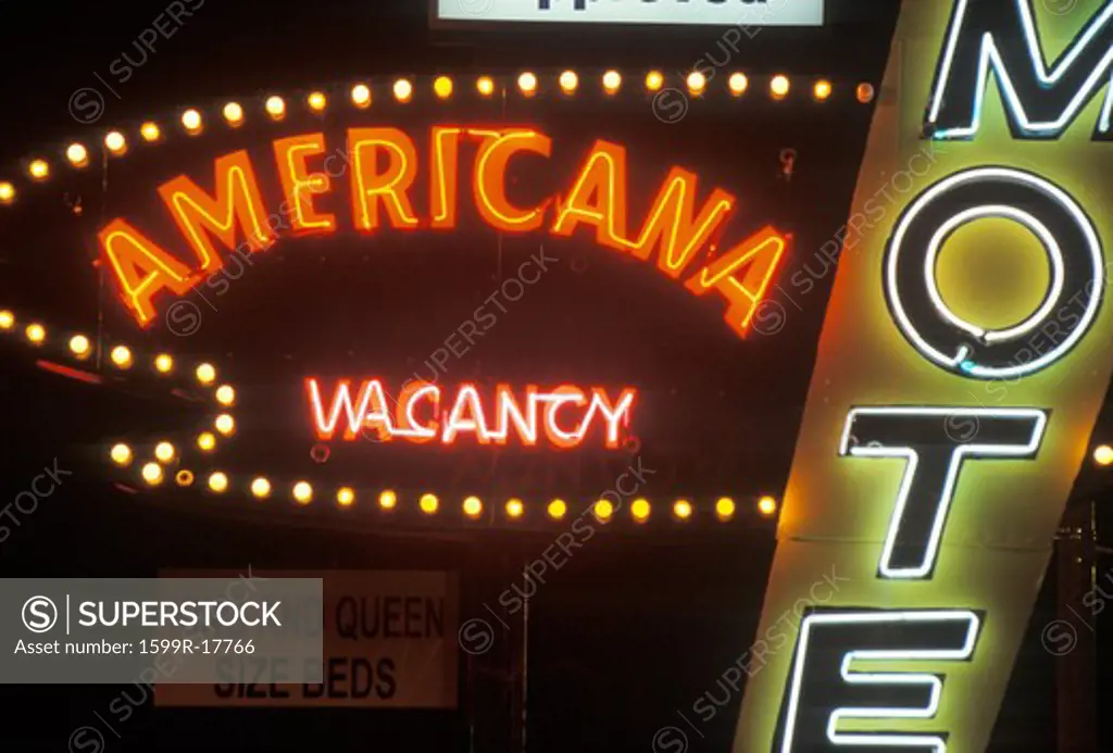 A neon sign that reads Americana Motel, vacancy