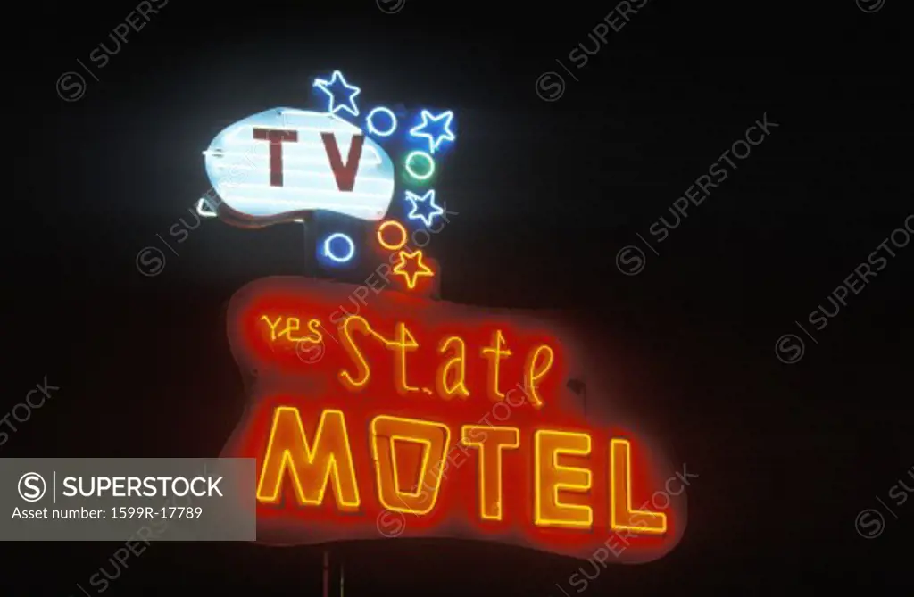 A neon sign that reads State Motel