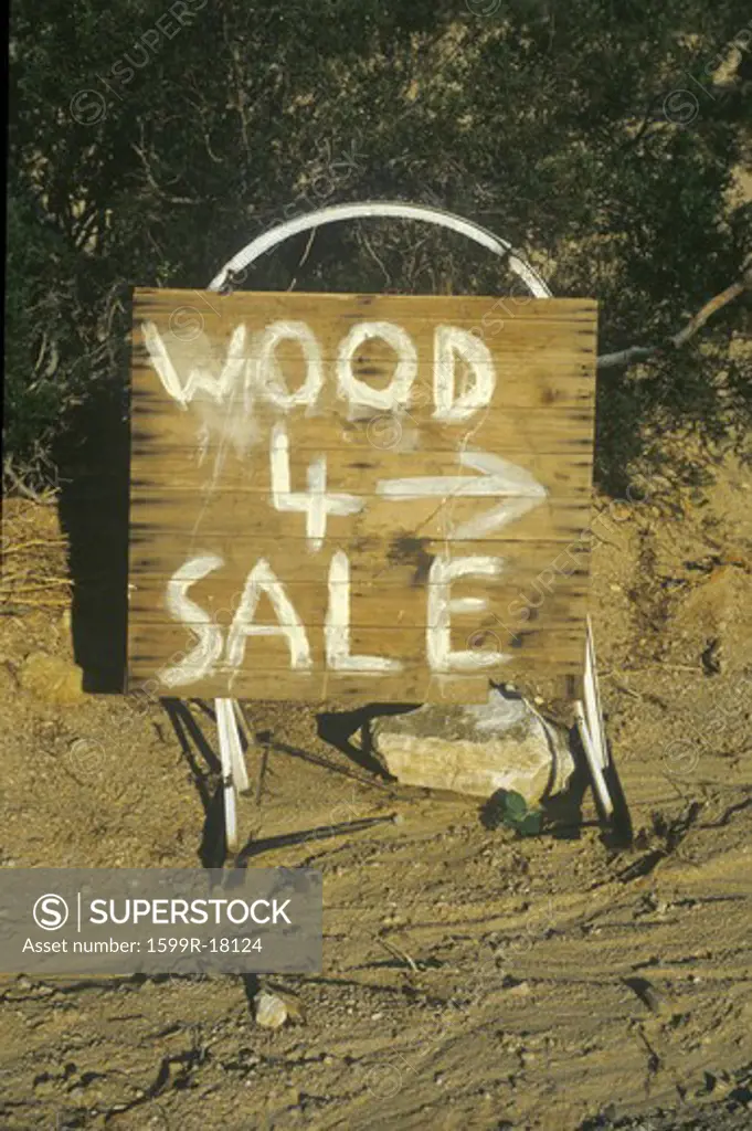 A sign that reads Wood 4 sale