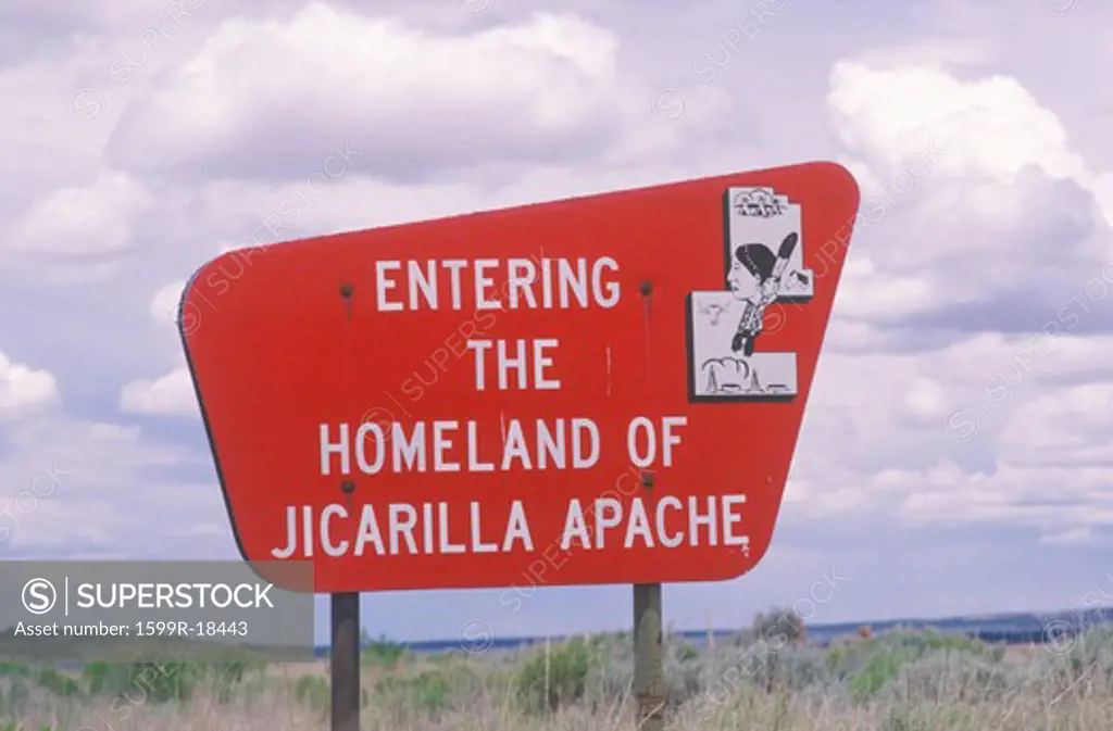 Bright red sign Entering the Homeland of Jicarilla Apache in NM