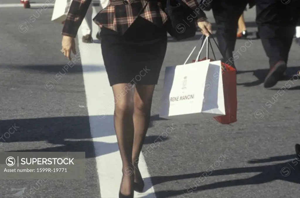 A well dressed woman with shopping bags, Beverly Hills, CA