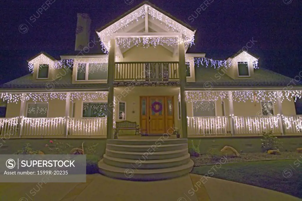 Front of house decorated with holiday lights