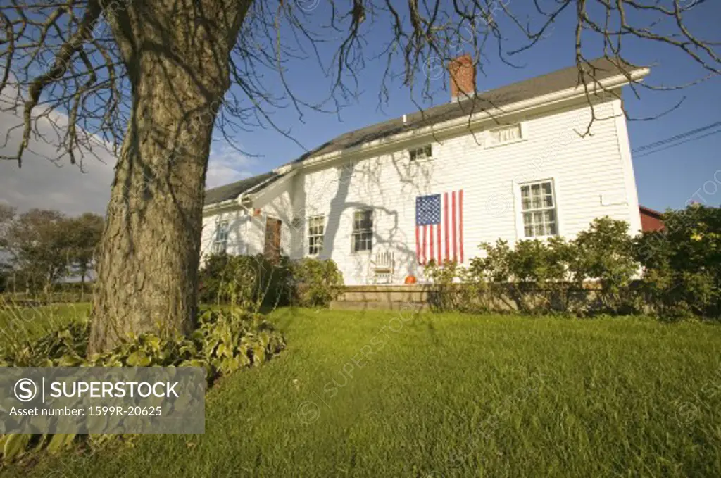American flag displayed on the side of home in Newport, Rhode Island