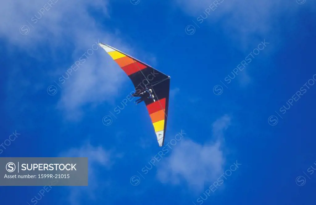 Multi-colored hang glider in mid-air, Hang Gliding Festival, telluride, Colorado