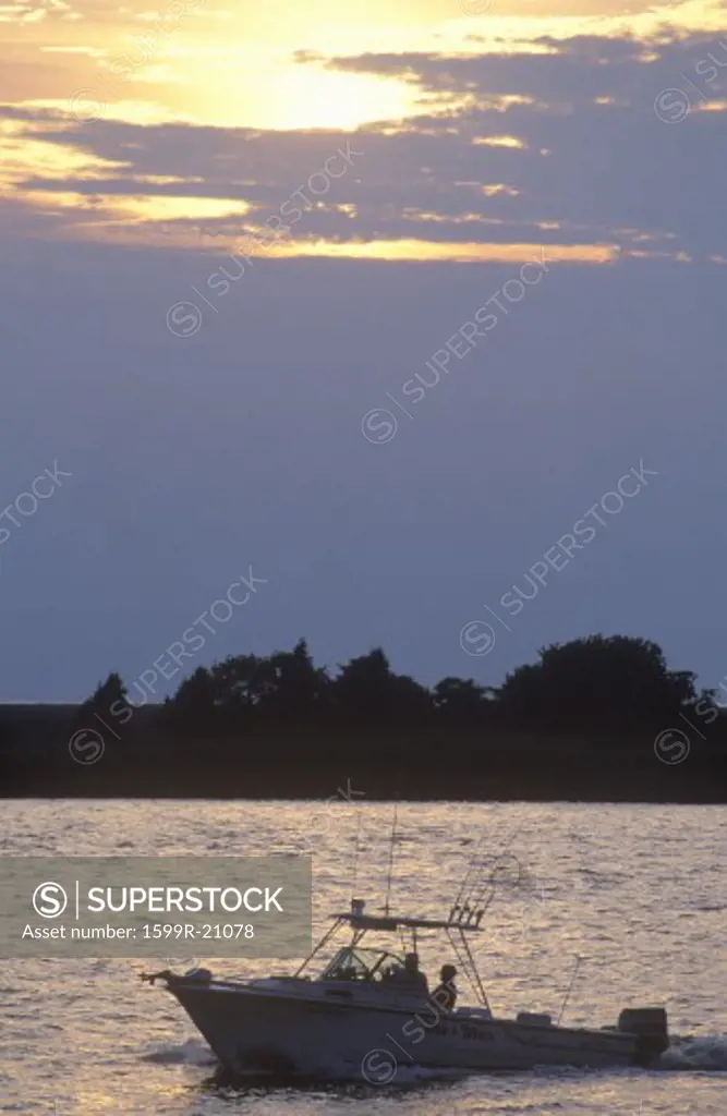 Sunset silhouette of fishing boat, Smith Island, Maryland