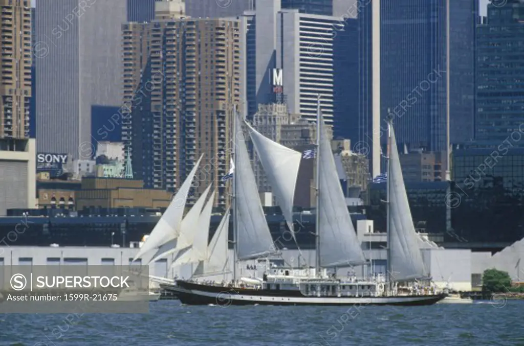 Tall ships sail in a parade in New York Harbor during the 100 year celebration for the Statue of Liberty, July 3, 1986