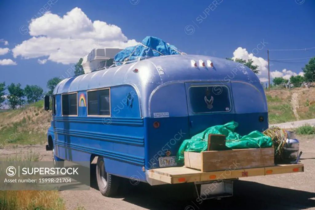 A homemade camper driving down the road to Taos, New Mexico