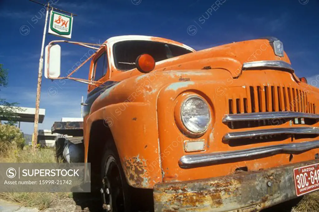 An old orange truck roadside off of Route 66 Arizona