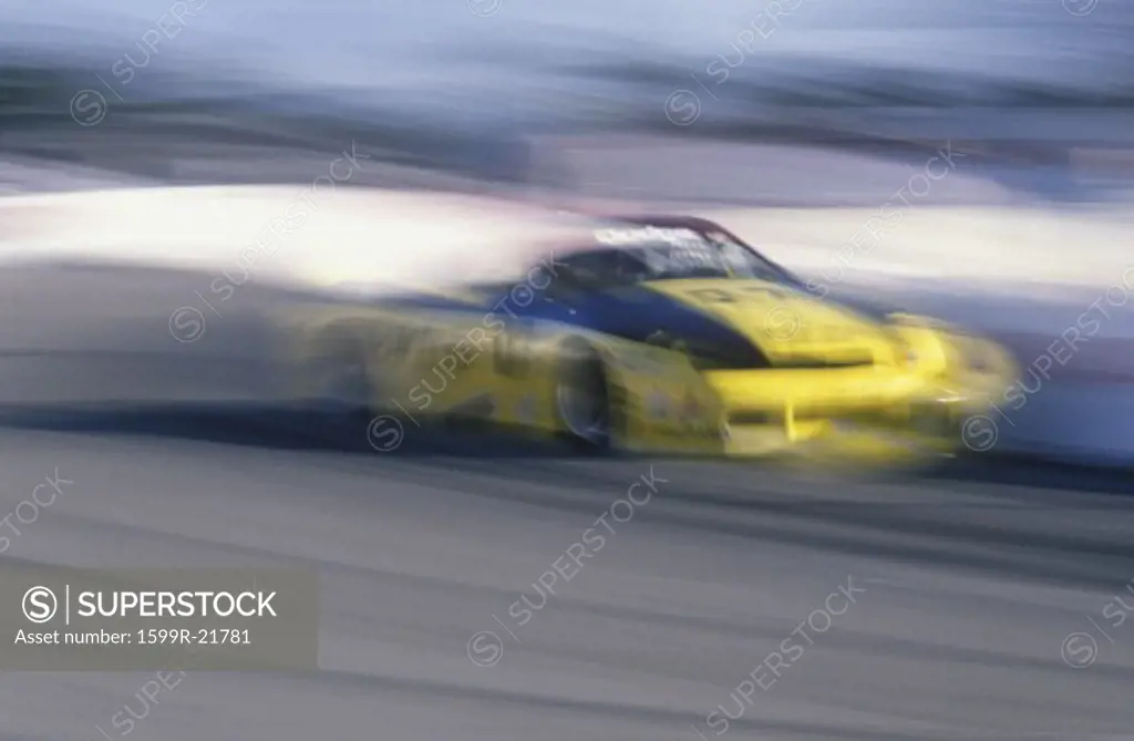A yellow car in the Toyota Grand Prix Race at the Indy Car World Series in Long Beach, CA