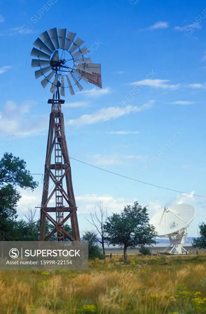 Radio telescope and old windmill at the National Radio Astronomy Observatory in Socorro, NM