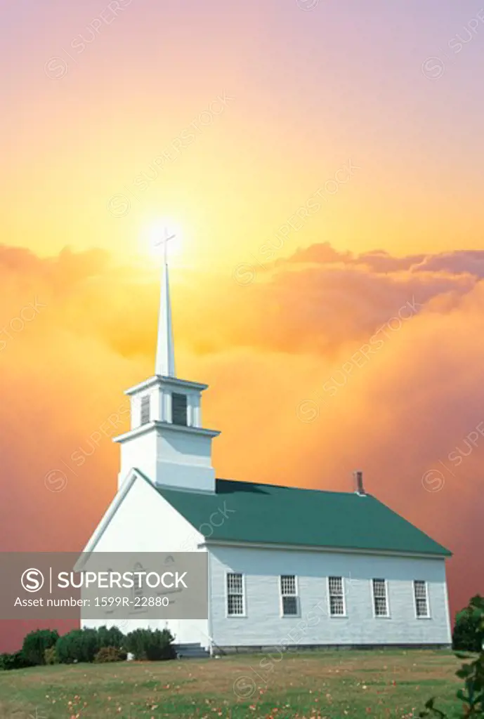 Composite image of a church amid golden clouds and heavenly light