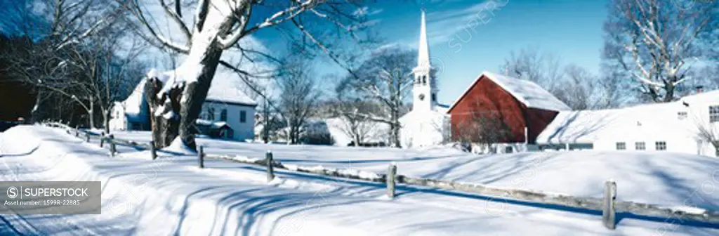 Digitally altered image of New England church in winter and snow covered trees