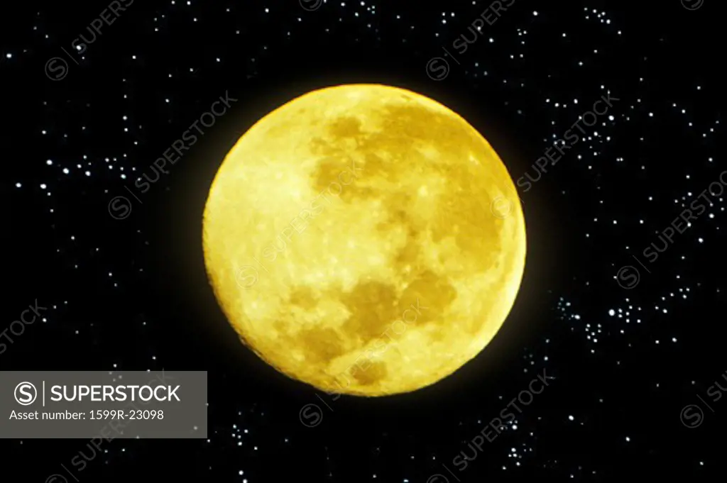 A close-up of a yellowish full moon in a starry sky
