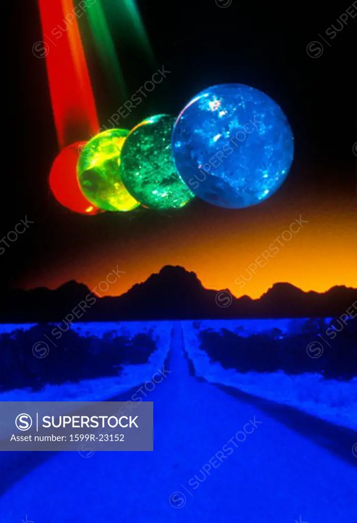 A blue and black horizon below several multi-colored spheres appearing as planets with laser lights shining through