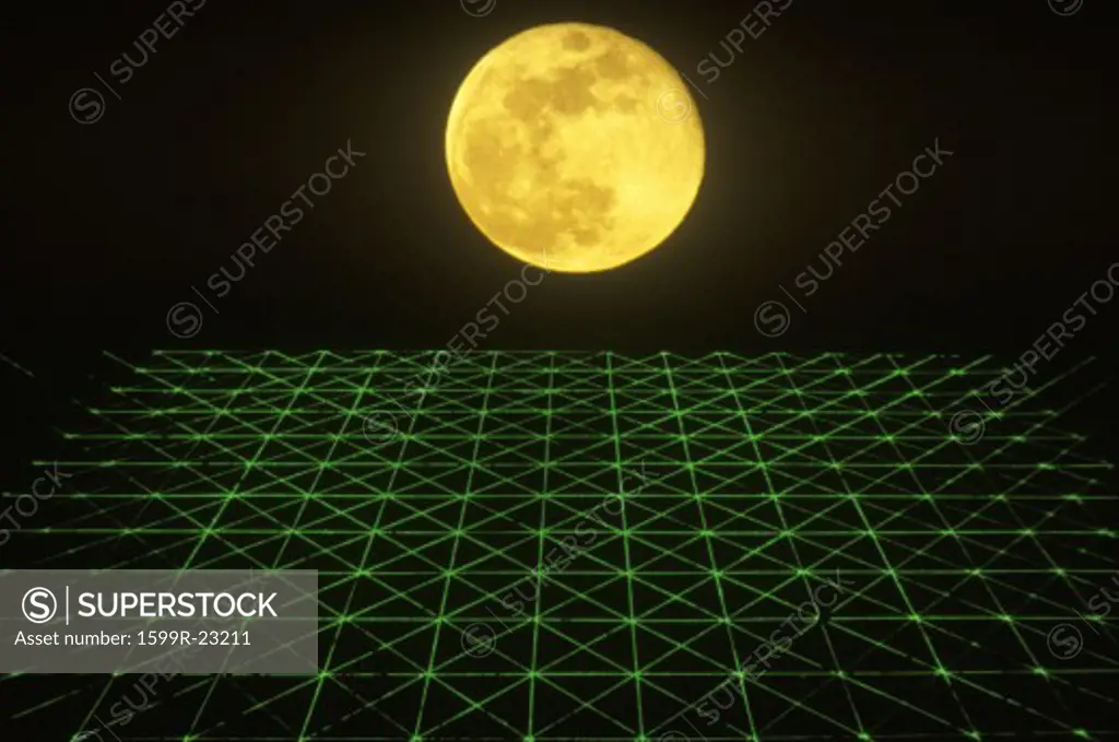 Space special effects composite with yellow moon and grid of green laser light