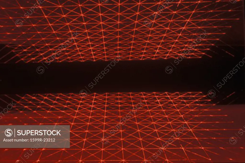 Space special effects composite of opposing grids of red laser light against a black starless sky