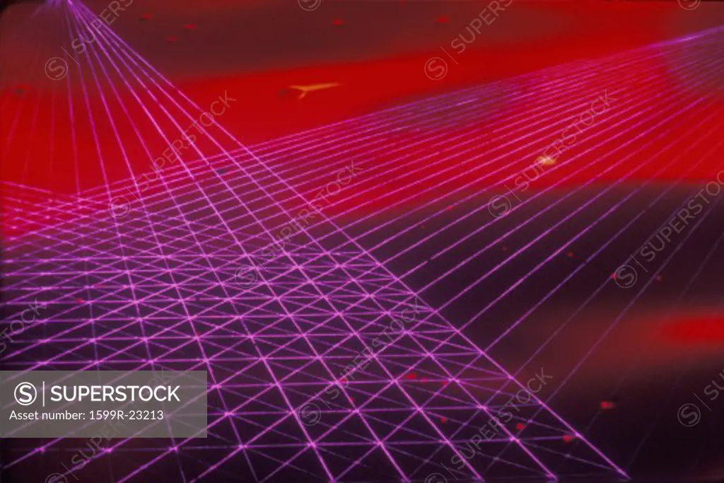 Space special effects composite of converging grids of magenta laser light against a red nebulous sky