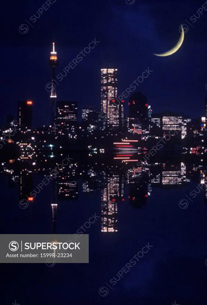 Nighttime cityscape and crescent moon composite