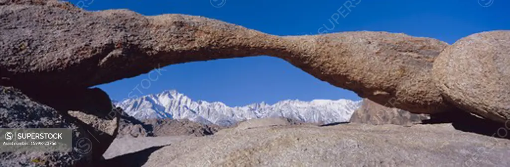 Panoramic view of Mount Whitney framed through Alabama Hills Arch in Alabama Hills near Lone Pine, California