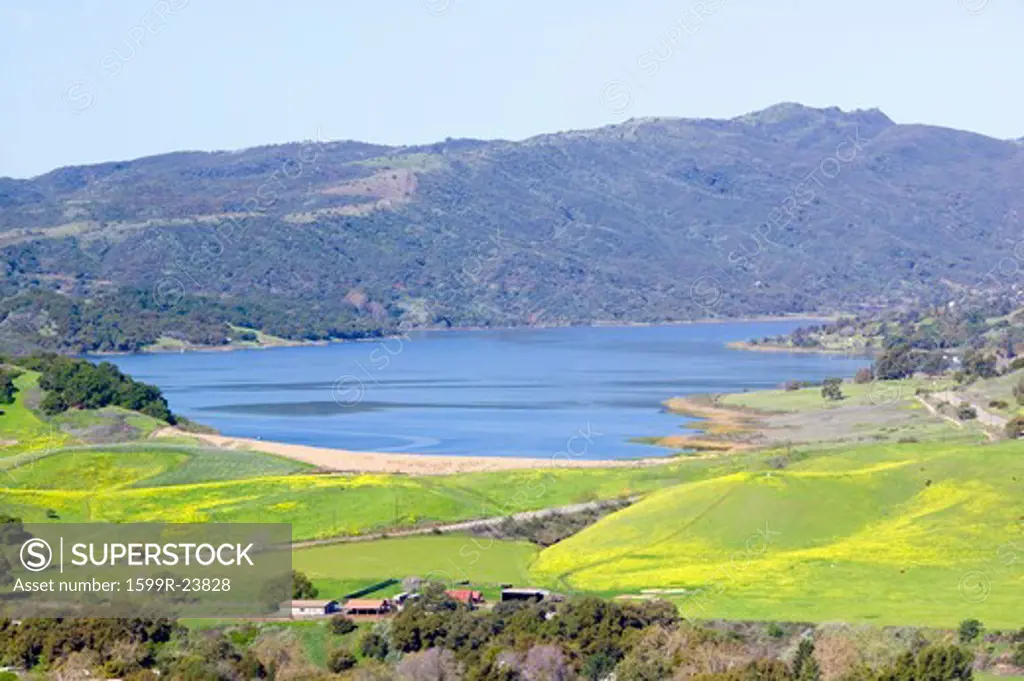 Elevated view of Lake Casitas and green fields in spring shot from Oak View, near Ojai, CA