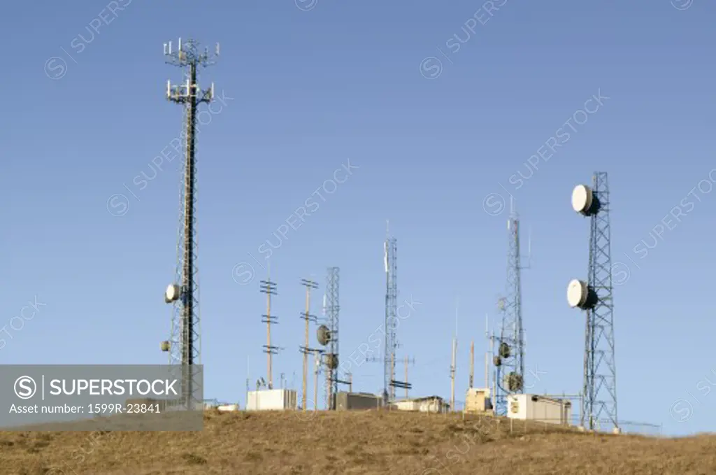 Communication antenna and cell towers clustered on hill near Cuyama, California, off of highway 167