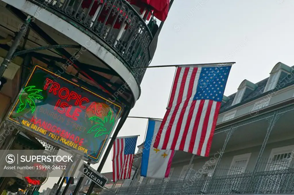 Tropical Isle neon sign and US Flag in French Quarter of New Orleans, Louisiana