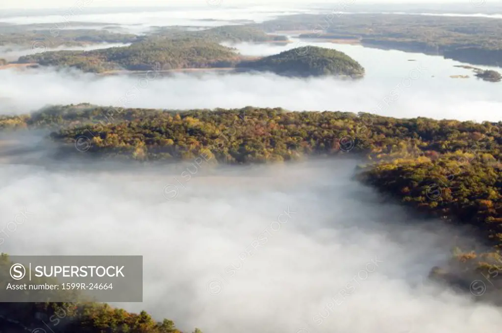 Aerial view of fog in autumn over islands and hills north of Portland Maine