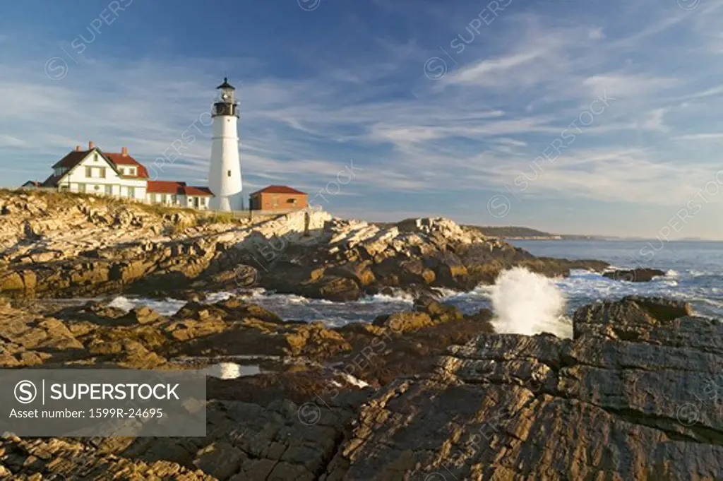Sunrise view of Portland Head Lighthouse and ocean wave, Cape Elizabeth, Maine