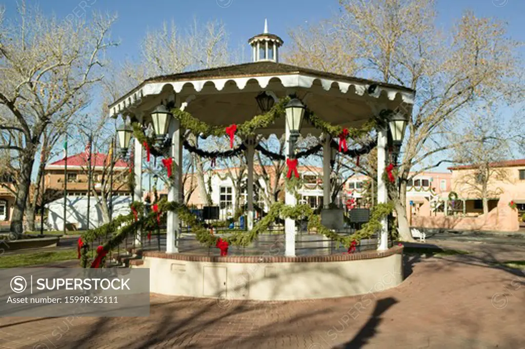 Gazebo wrapped in Christmas décor is in park in Old Town of Albuquerque, New Mexico
