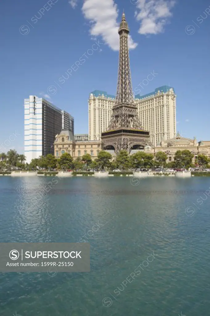 Water fountain display at Bellagio Casino with Paris Casino and Eiffel Tower in Las Vegas, NV