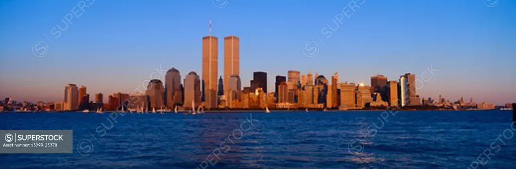 Panoramic view of lower Manhattan and Hudson River, New York City skyline, NY with World Trade Towers at sunset