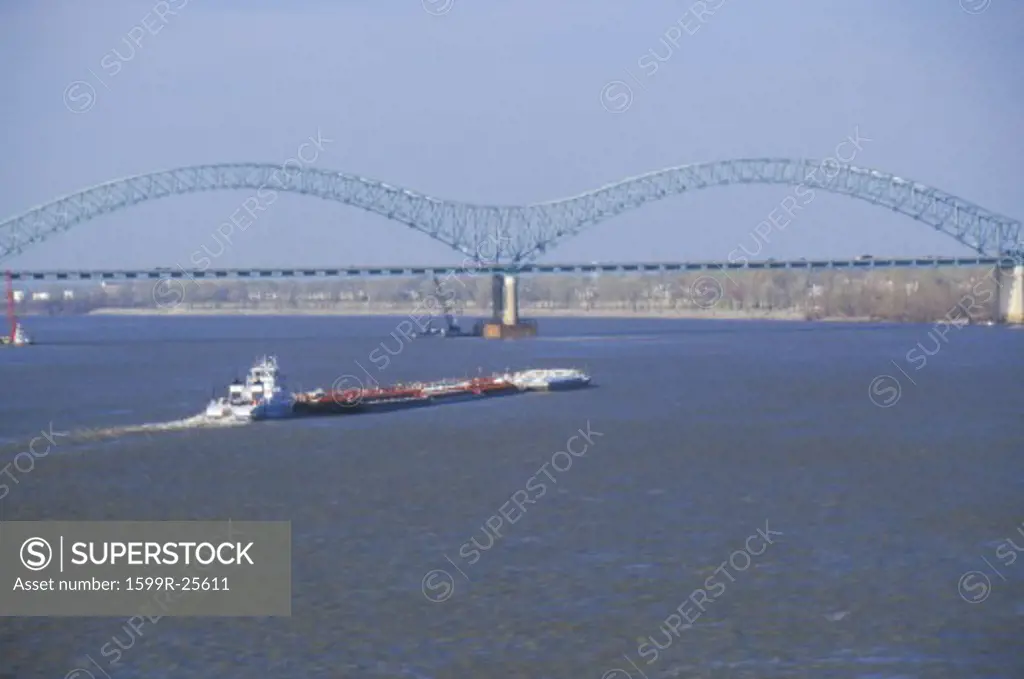 Barge on Mississippi River with Bridge and Memphis, TN in background