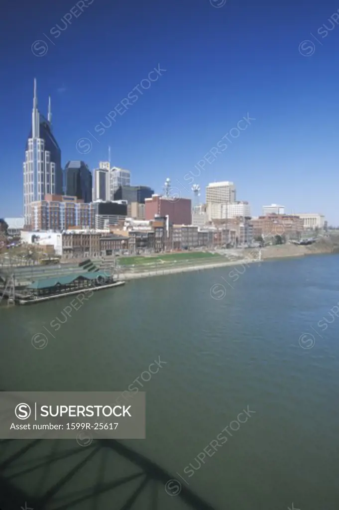 State capitol Nashville, TN skyline with Cumberland River in foreground