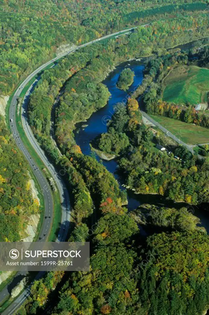 Aerial view of woods near Stowe, VT with river on Scenic Route 100 in autumn
