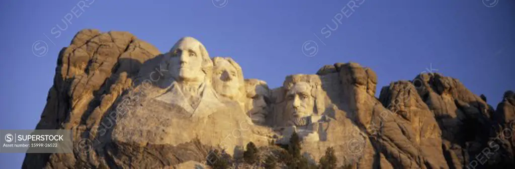 Panoramic sunrise view on Presidents George Washington, Thomas Jefferson, Teddy Roosevelt and Abraham Lincoln at Mount Rushmore National Memorial, South Dakota